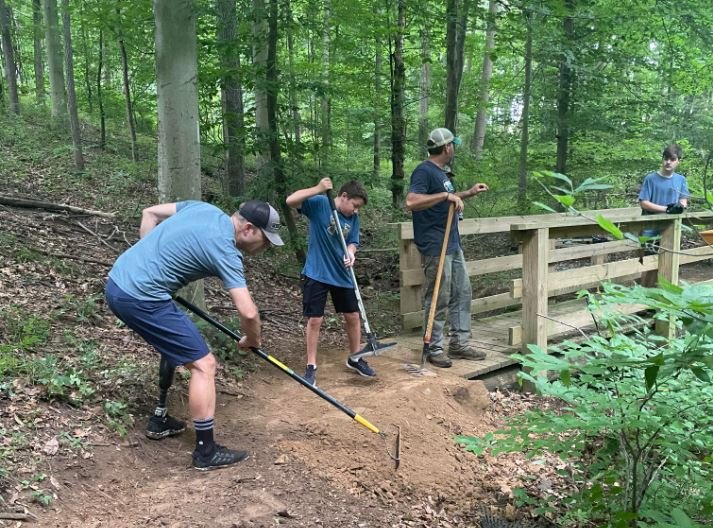 Trail maintenance work being done by the Hellbenders